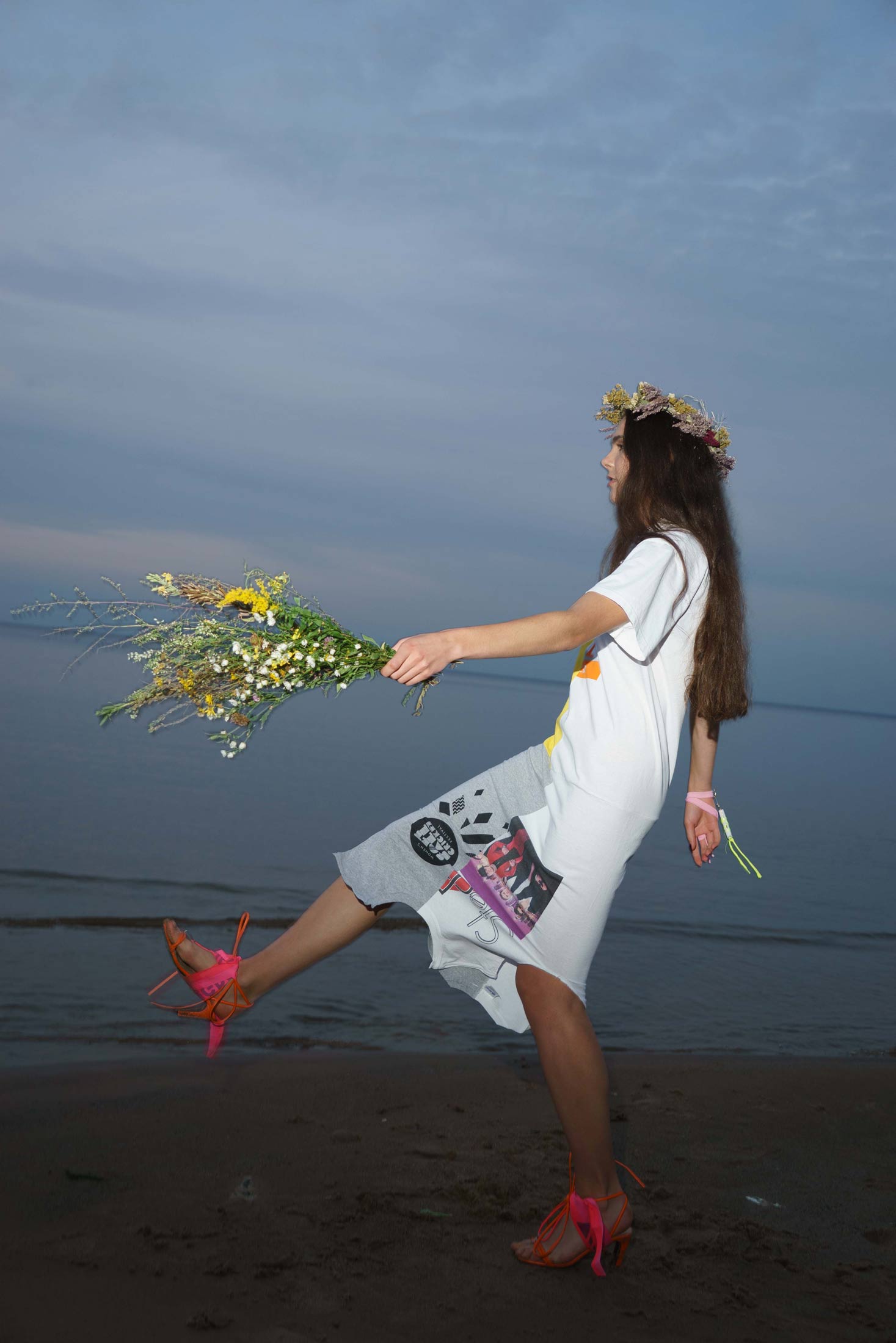 Regenerated cotton t-shirt patchwork dress shown in side view while moving, highlighting fluid drape.