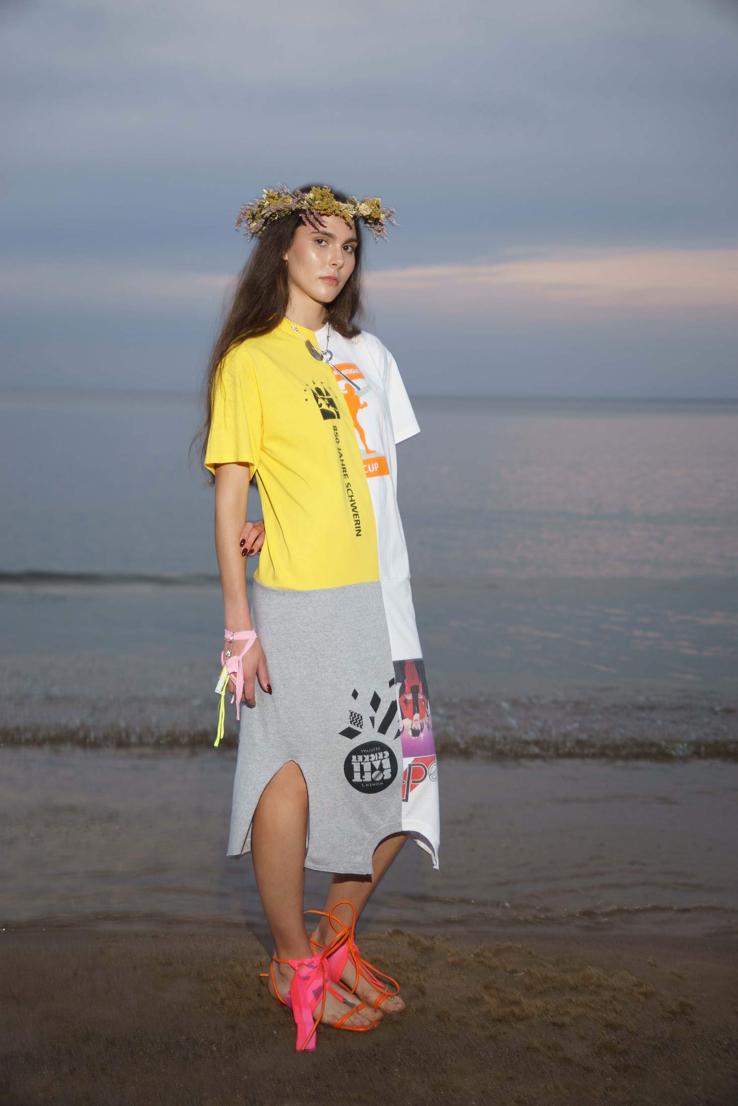 Side view of multicolor cotton dress crafted from repurposed graphic t-shirts, shown in wear.